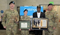 Photo of Tobyhanna Army Depot Commander Colonel Daniel L. Horn, then-Depot Sergeant Major Michael J. Wiles and AUSA Tobyhanna Chapter President Kelvin Spencer present the Warfighter of the Quarter award to Sergeant Megan Kennedy.
