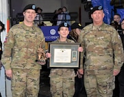 Photo of Tobyhanna Army Depot Commander Colonel Daniel L. Horn and then-Depot Sergeant Major Michael J. Wiles present the Warfighter of the Quarter award to Sergeant Megan Kennedy.