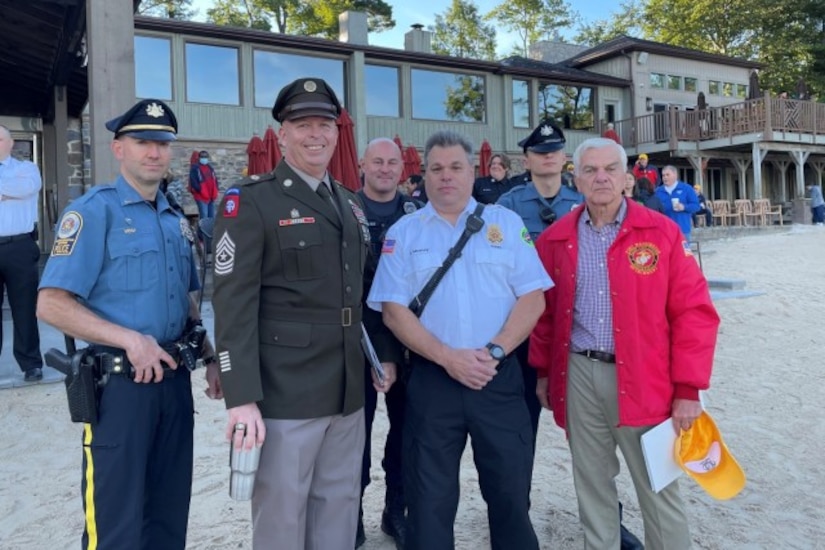 Photo of Tobyhanna's Sergeant Major Michael J. Wiles poses with members of local Fire and Emergency Services organizations during a September 11 ceremony.