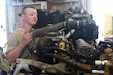 Cpl. Wyatt Chapman of India Company, 328th Brigade Support Battalion, 56th Stryker Brigade Combat Team performs maintenance on a Stryker vehicle engine at the California National Guard Maneuver Area Training Equipment Site (MATES) during the 56 SBCT’s rotation at the National Training Center, Fort Irwin, Calif., on June 22, 2022. (U.S. Army photo by Master Sgt. Doug Roles)