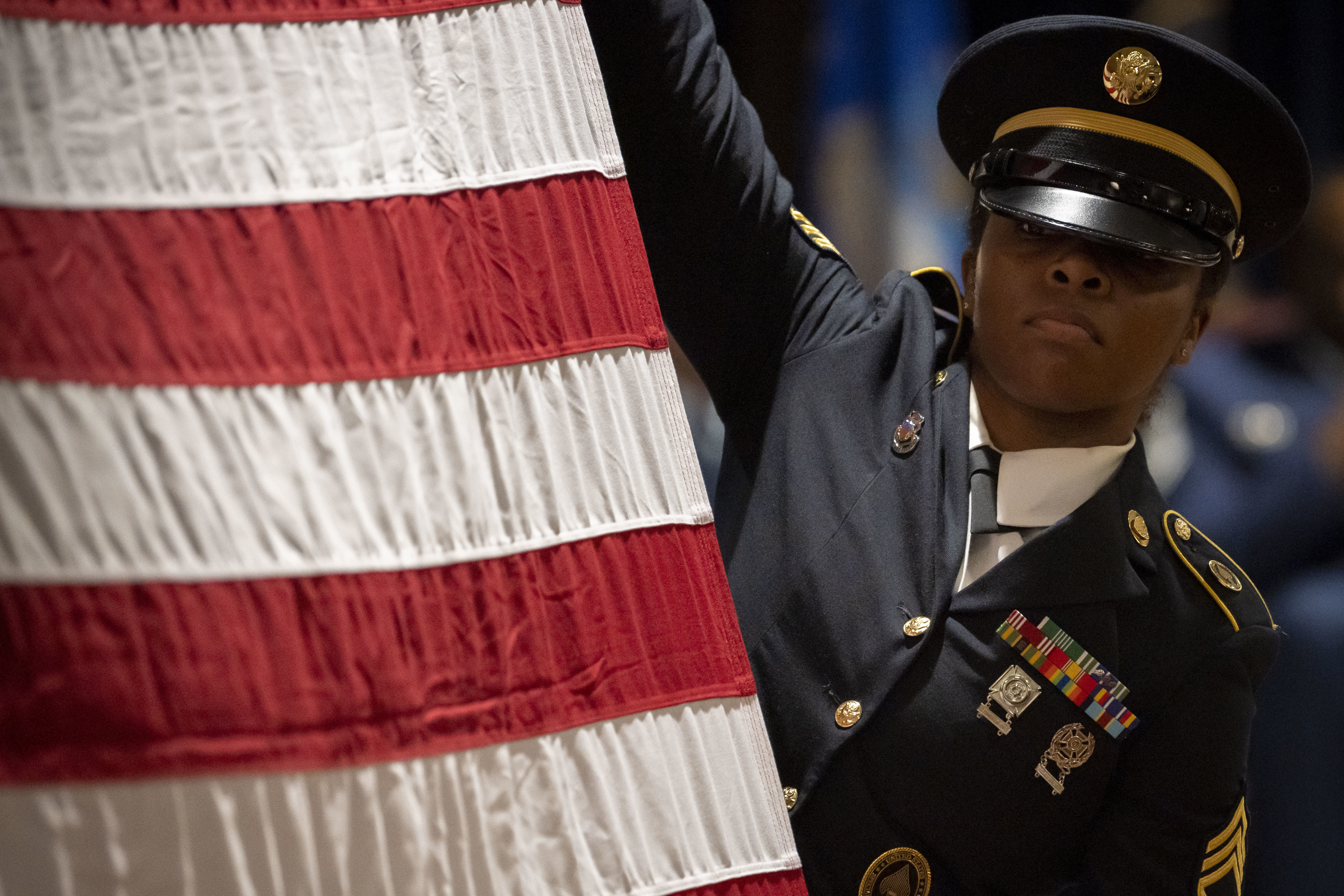 soldiers saluting the flag