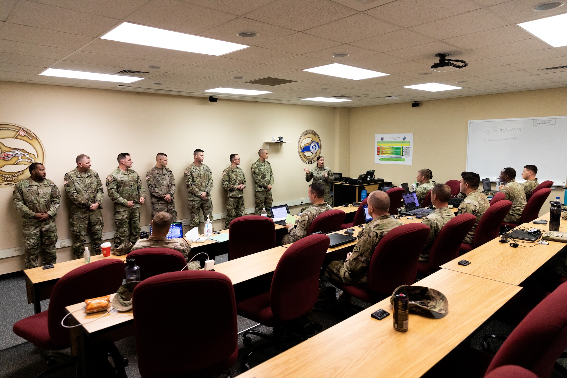 Army Chief Warrant Officer 4 Jennifer Ritchie (center) introduces new graduates of Warrant Officer Candidacy School to warrant officer applicants at Boone National Guard Center in Frankfort, Ky. on Oct. 15, 2022. The newly commissioned warrant officers are presenting mentor hour to Soldiers in the Warrant Officer Candidate Accession Program with the Kentucky National Guard. (U.S. Army photo by Andy Dickson)