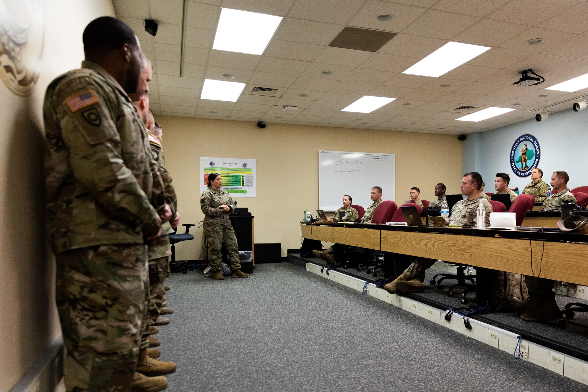 Army Chief Warrant Officer 4 Jennifer Ritchie (center) introduces new graduates of Warrant Officer Candidacy School to warrant officer applicants at Boone National Guard Center in Frankfort, Ky. on Oct. 15, 2022. The newly commissioned warrant officers are presenting mentor hour to Soldiers in the Warrant Officer Candidate Accession Program with the Kentucky National Guard. (U.S. Army photo by Andy Dickson)