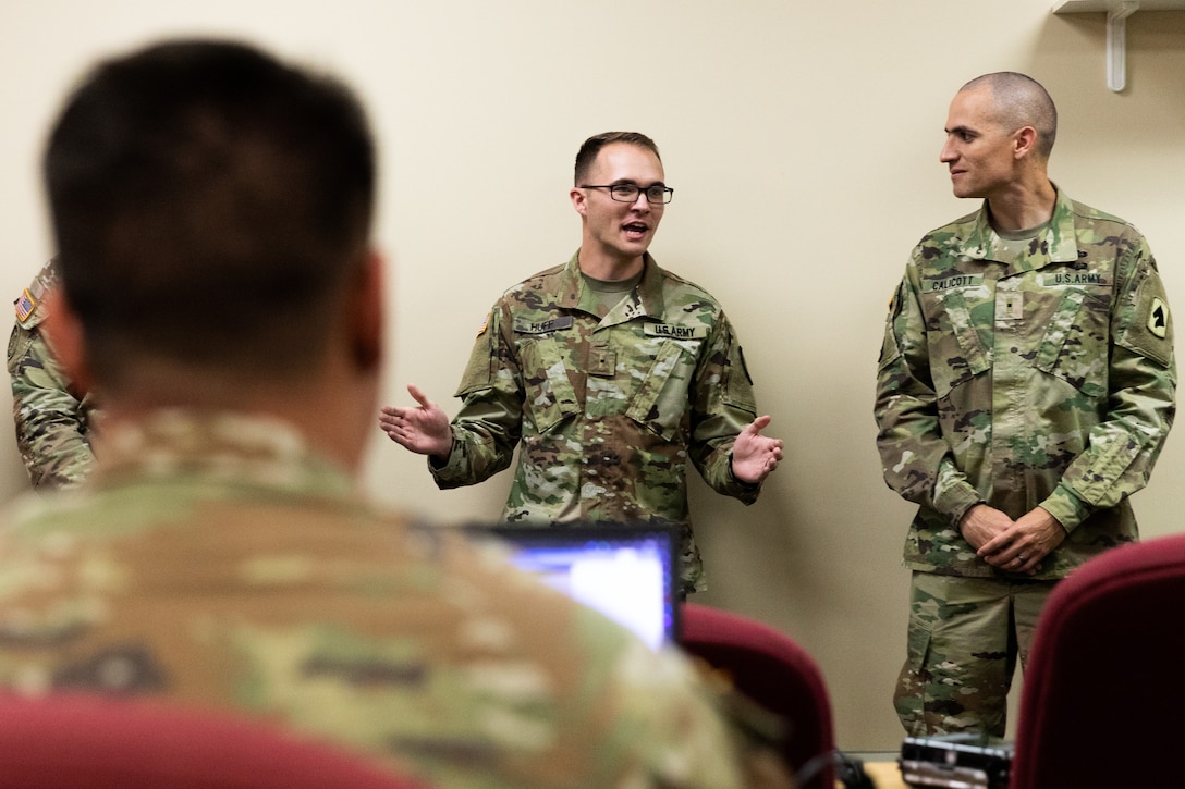 Army Warrant Officer Tucker Huff (center) talks to warrant officer applicants during the Warrant Officer Candidate Accession Program (WOCAP) at Boone National Guard Center in Frankfort, Ky. on Oct. 15, 2022. Huff recently graduated Warrant Officer Candidate School and is giving advice to Soldiers applying to become warrant officers. (U.S. Army photo by Andy Dickson)