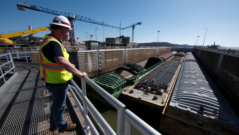 Lockmaster Wayne Chapman watches as barges split from the Motor Vessel Natalie Alexander from the Port of Houston locks through Kentucky Lock Feb. 28, 2023. Chapman is responsible with ensuring safe operations at the active lock on the Tennessee River, which is very close to a U.S. Army Corps of Engineers Nashville District construction project to build a new 1,200-foot-long by 110-foot-wide lock. (USACE Photo by Lee Roberts)