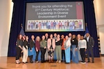 Members of Naval Surface Warfare Center, Carderock Division's Inclusion, Diversity, Equity and Accessibility Employee Resource Group (IDEA ERG) pose on stage after successfully hosting the 21st Century Workforce Leadership in a Diverse Environment Event (LDEE) in West Bethesda, Md., on March 1. (U.S. Navy photo by Brittny Odoms)