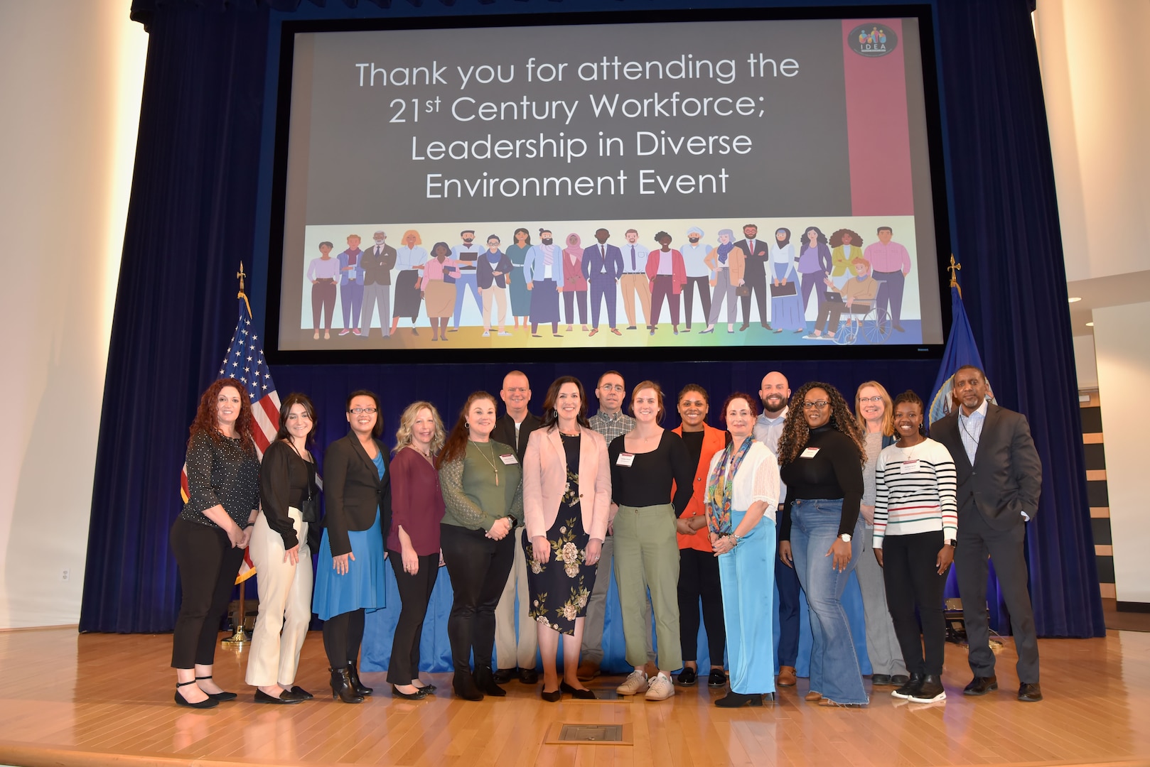 Members of Naval Surface Warfare Center, Carderock Division's Inclusion, Diversity, Equity and Accessibility Employee Resource Group (IDEA ERG) pose on stage after successfully hosting the 21st Century Workforce Leadership in a Diverse Environment Event (LDEE) in West Bethesda, Md., on March 1. (U.S. Navy photo by Brittny Odoms)