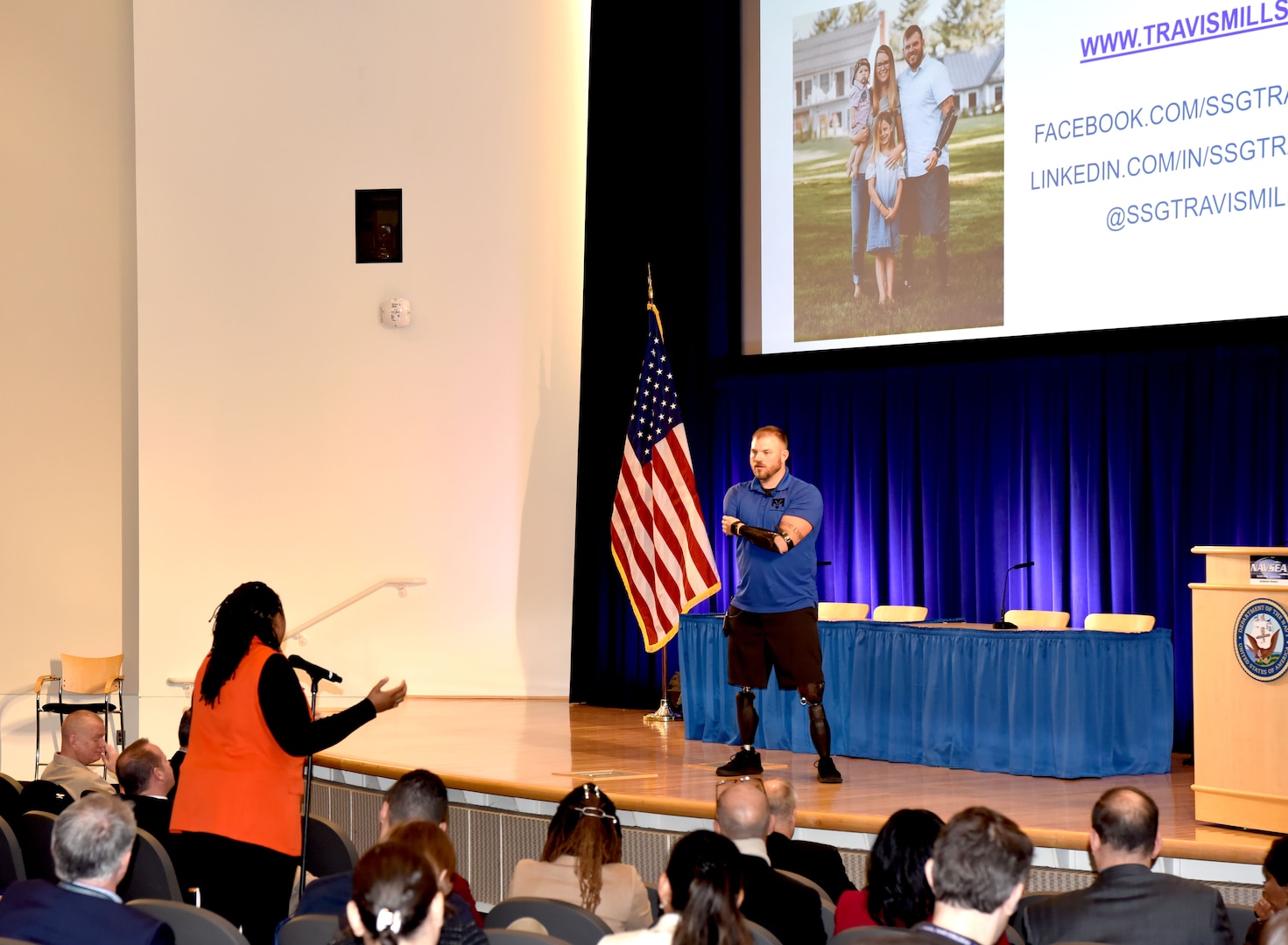 Naval Surface Warfare Center, Carderock Division engineer Ashlee Floyd (left) asks a question to special guest speaker Travis Mills (right) during the 21st Century Workforce: A Leadership in a Diverse Environment Event (LDEE) hosted by Carderock in West Bethesda, Md., on March 1. Mills, a retired 82nd Airborne Staff Sergeant, lost all of his limbs after surviving the impact of an Improved Explosive Device on his third tour of duty in Afghanistan in 2012. (U.S. Navy photo by Brittny Odoms)