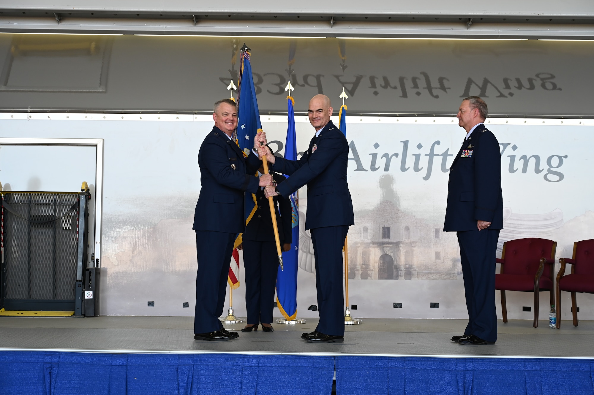 Brig. Gen. Derin Durham, 4th Air Force commander, offers the 433rd Airlift Wing guidon to Col. William Gutermuth, 433rd AW commander, during a change of command ceremony March, 5, 2023, at Joint Base San Antonio-Lackland, Texas. Gutermuth was formerly the commander of the 514th Air Mobility Wing located at Joint Base McGuire-Dix-Lakehurst, New Jersey. (U.S. Air Force photo by Master Sgt. Samantha Mathison)