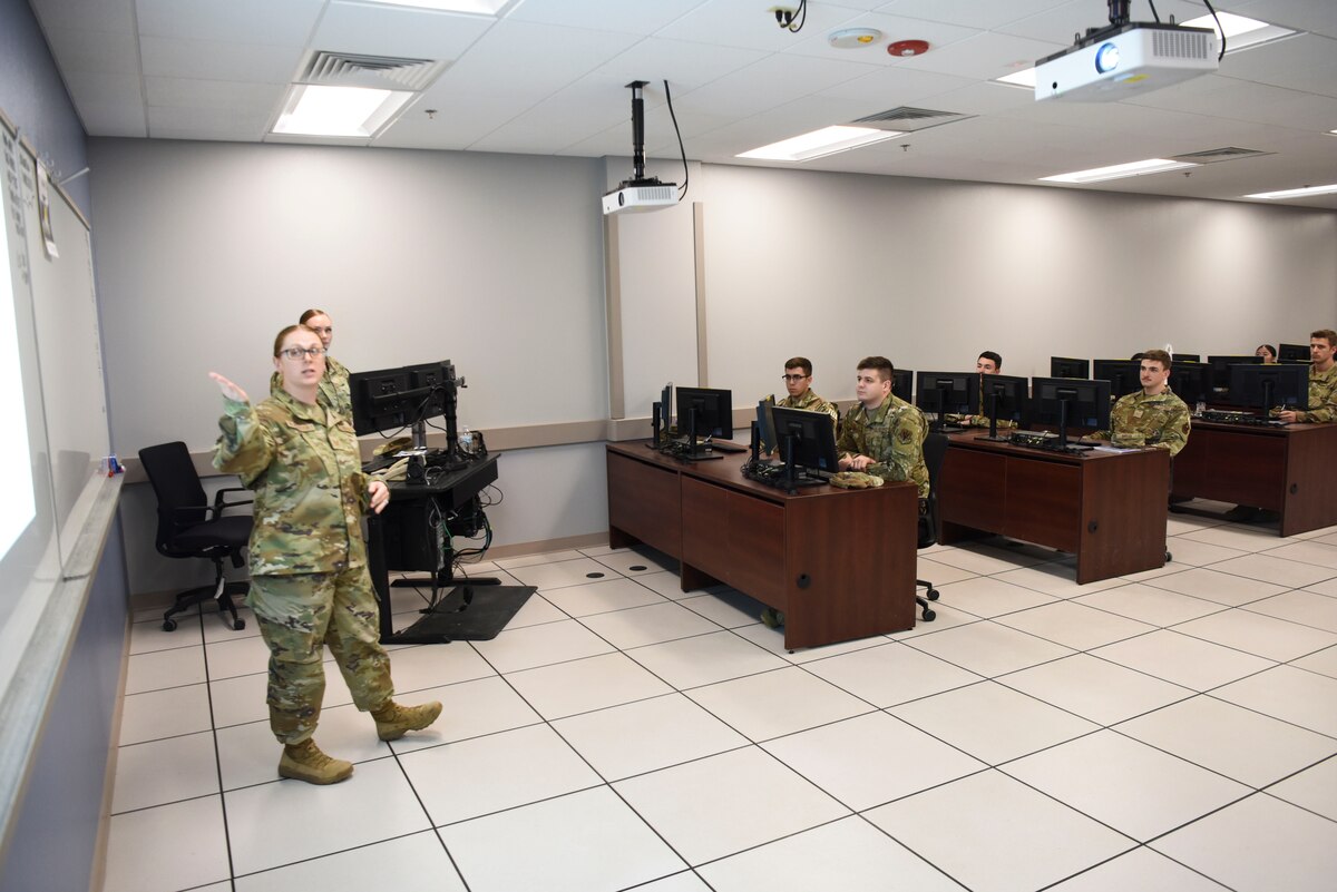 U.S. Air Force Tech. Sgt. Jan Neverdosky, 316th Training Squadron instructor, teaches 316th TRS students during the Analysis and Production course