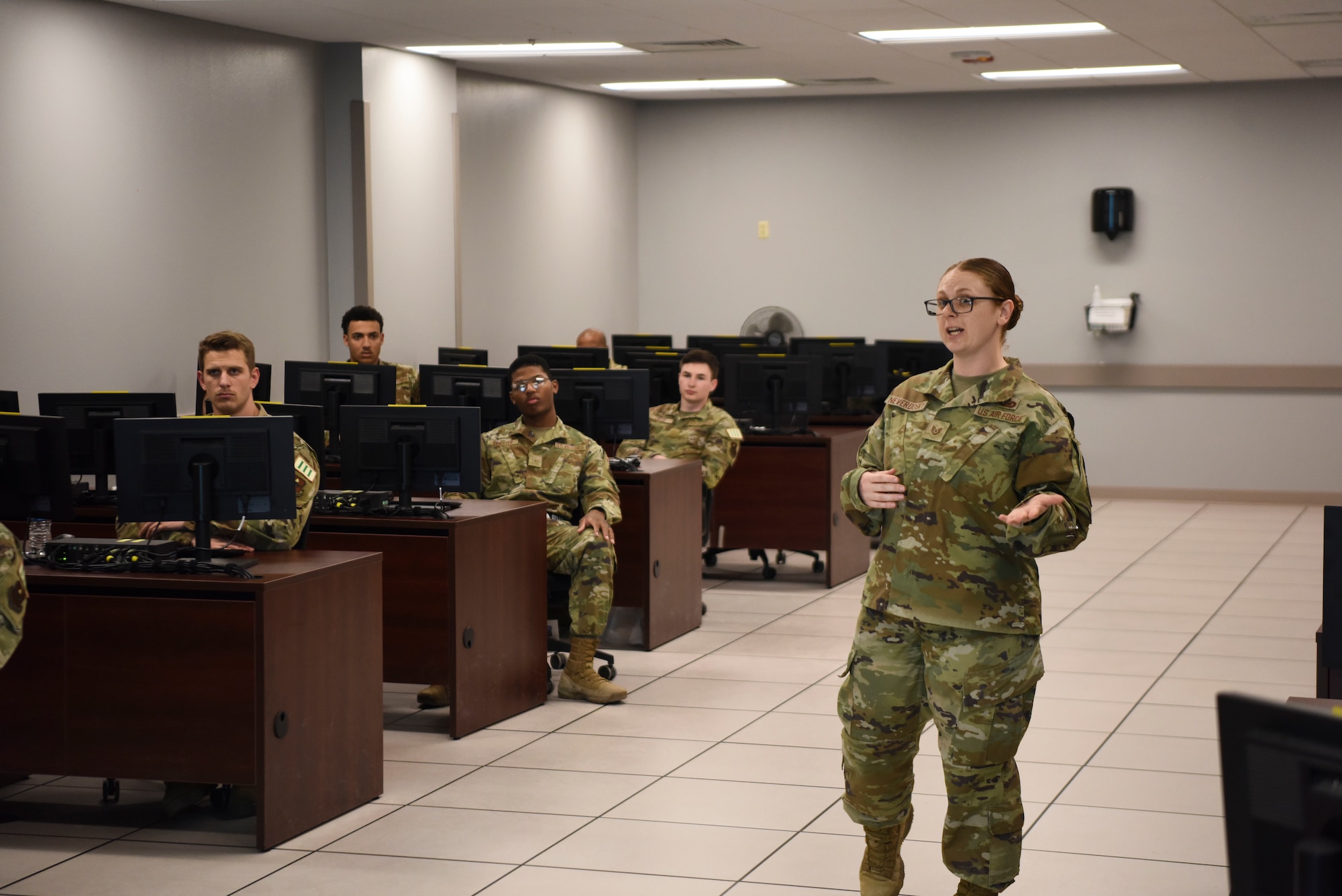 U.S. Air Force Tech. Sgt. Jan Neverdosky, 316th Training Squadron instructor, teaches students during the Analysis and Production Course.