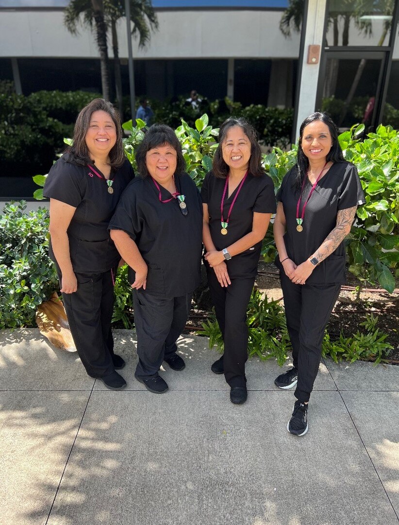 Our Amazing Nurses at Warrior Ohana Medical Home were awarded the Armed Forces Civilian Service Medal (AFCSM) for their support during a COVID drive at Schofield Barracks in 2021. The Armed Forces Civilian Service Medal (AFCSM) is established to recognize the contributions and accomplishments of the U.S. Department of Defense civilian workforce who directly support the military forces, when those members are engaged in military operations of a prolonged peacekeeping or humanitarian nature.

The AFCSM symbolizes the importance the Department of Defense attaches to civilian service and recognizes the value of civilian service in helping to accomplish the U.S. Government's objectives. This award honors those employees who support designated operations under the same or similar conditions as U.S. military members, thereby strengthening the partnership between the civilian services and uniformed services.

(pictured left to right): Ms.Tresi Peterson, Ms. Jasmine Arakaki, Ms. Alexa Tanji, and Ms. Jeanette Garcia.