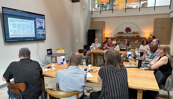 People listen to a virtual presentation.
