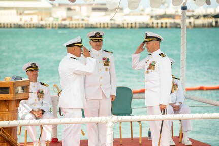 230228-N-NO841-0216 JOINT BASE PEARL HARBOR-HICKAM (Feb. 28, 2022) Cmdr. Gieorag Andrews, prospective commanding officer of Virginia-class attack submarine USS Missouri (SSN 780), left, relieves Cmdr. Carlos Martinez, commanding officer of Missouri, right, as commanding officer during a change of command ceremony for the Virginia-class attack submarine USS Missouri (SSN 780) on Joint Base Pearl Harbor-Hickam, Hawaii, Feb. 28, 2023. Missouri is the seventh Virginia-class submarine and the fourth U.S. Navy ship to be named for the state of Missouri. (U.S. Navy photo by Torpedoman 3rd Class Tommy Heng)