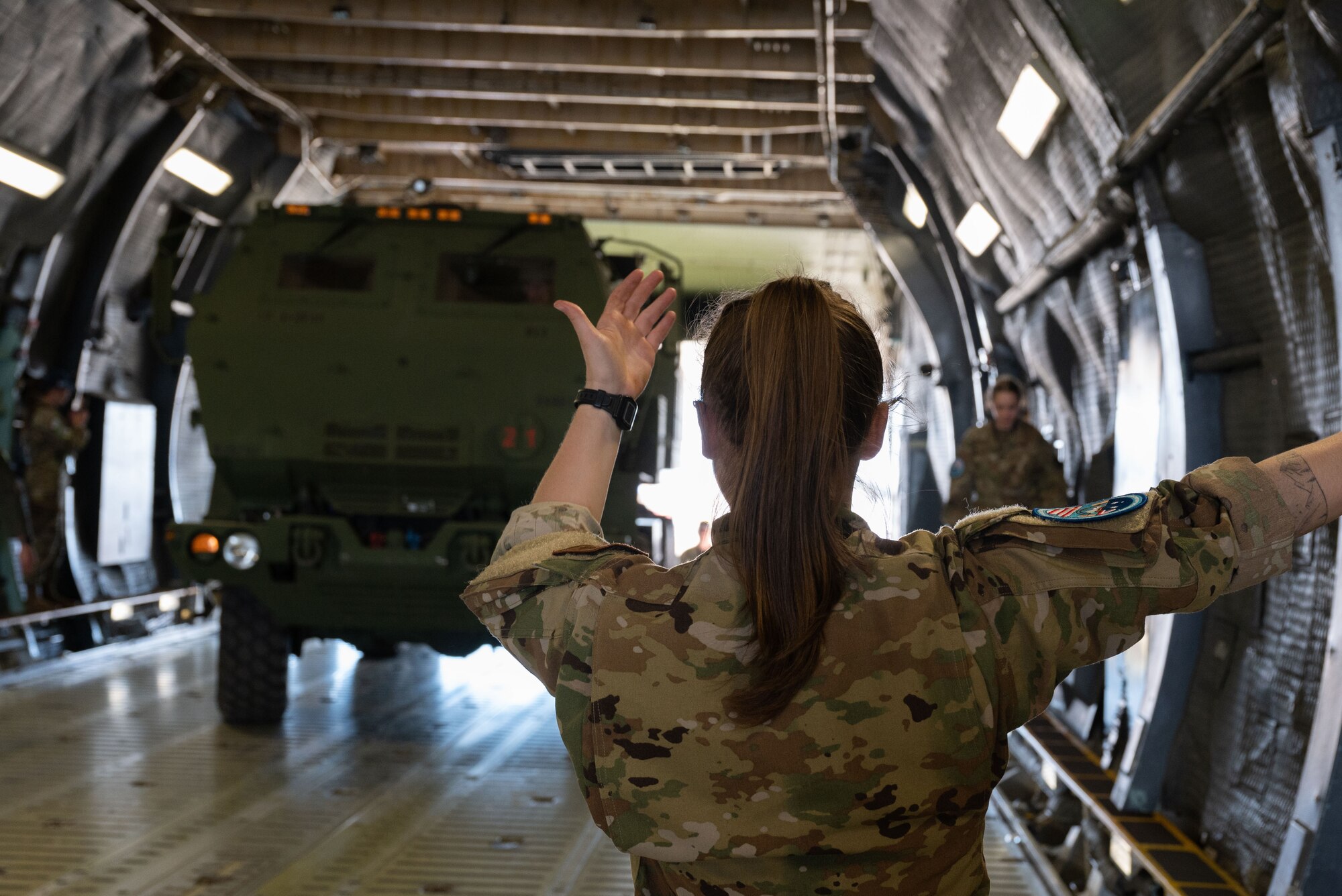 U.S. Air Force Senior Airman Jenna Hayes, C-5M Super Galaxy loadmaster, loads an M142 HIMARS as spectators watch at the 2023 Australian International Airshow and Aerospace & Defence Exposition—AVALON 23—at Avalon International Airport, March 2, 2023. AVALON 23 is the largest event of its kind in the Southern Hemisphere, attracting aviation and aerospace professions, key defense personnel, aviation enthusiasts and the general public. (U.S. Air Force photo by Tech. Sgt. Hailey Haux)