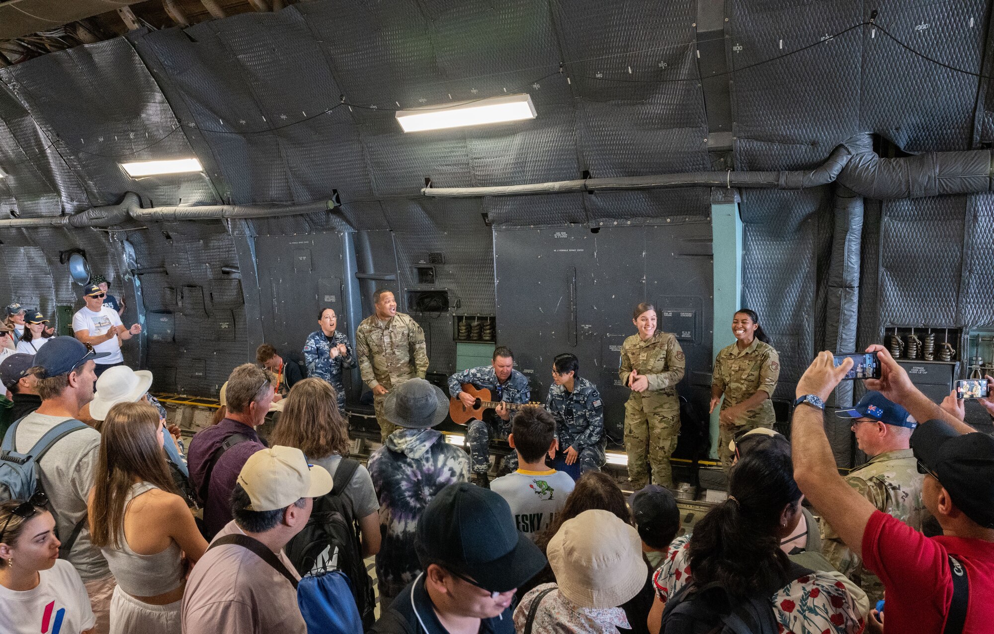 The U.S. Air Force Band of the Pacific-Hawaii performs a song inside the C-5M Super Galaxy static display at the 2023 Australian International Airshow and Aerospace & Defence Exposition—AVALON 23—at Avalon International Airport, March 4, 2023. Our steadfast relationship with Australia, deeply rooted in our common principles and shared values, stems from working together day in and day out across the full spectrum of operations and will continue to prosper as we further integrate our efforts through events such as AVALON 23. Through the power and energy of music, the Band of the Pacific’s impressive performances create engaging moments that serve as a demonstration of the excellence displayed by the 46,000 Airmen serving, stationed and deployed throughout the Indo-Pacific. (U.S. Air Force photo by Tech. Sgt. Hailey Haux)
