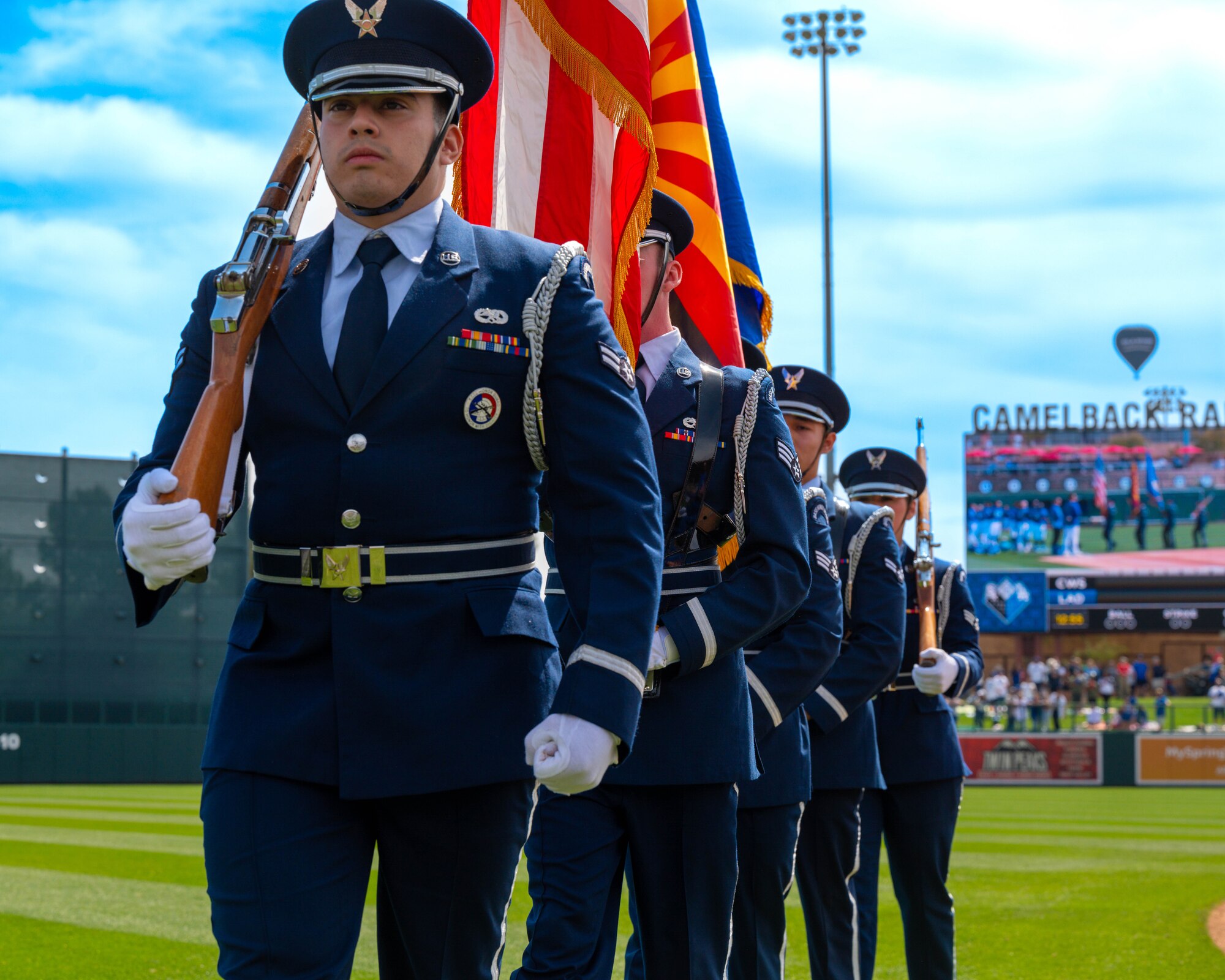 Members of the Luke Air Force Base honor guard march after presenting the colors during the national anthem, March 5, 2023, at Camelback Ranch in Glendale, Arizona.