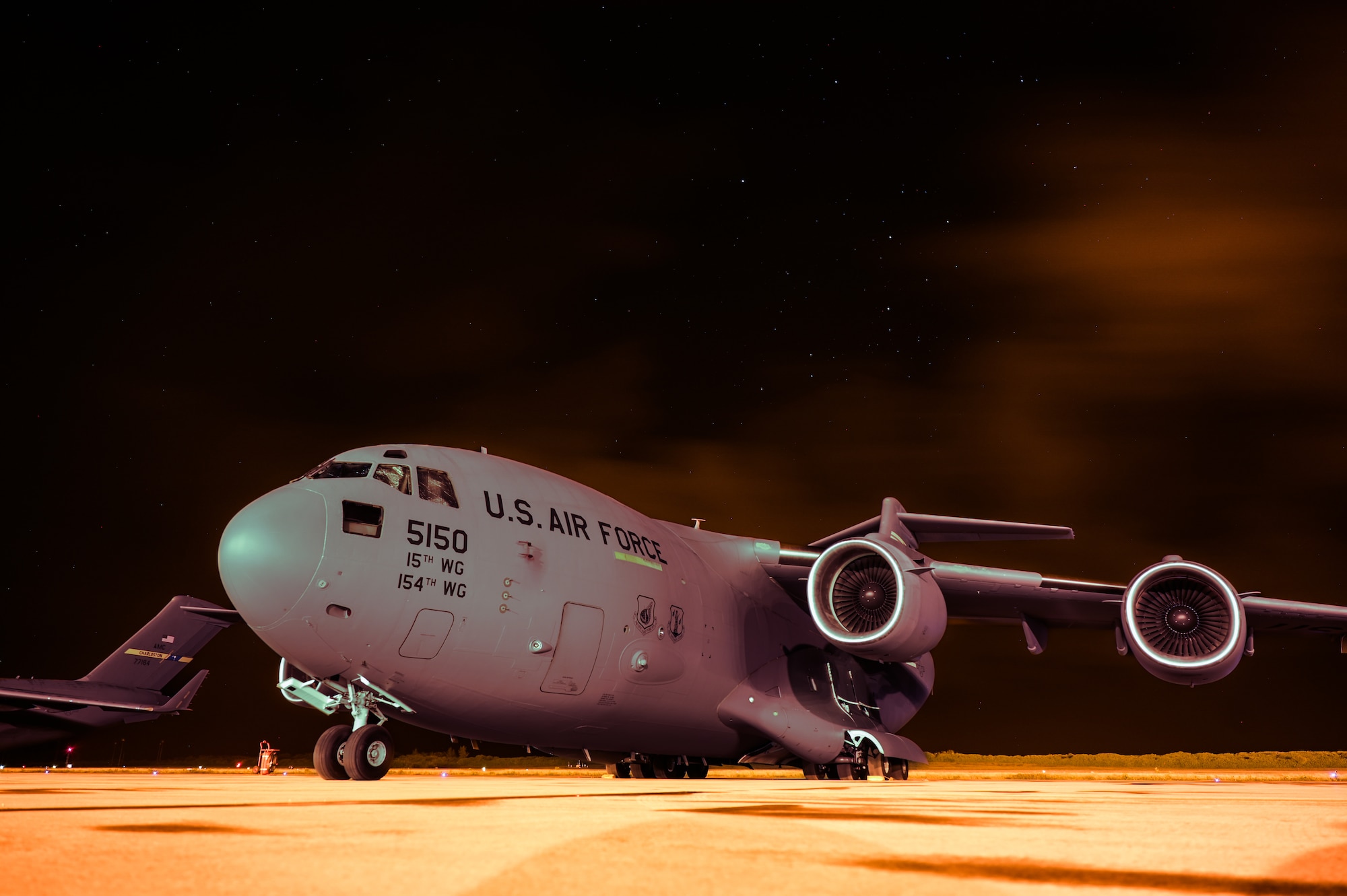 A U.S. Air Force C-17 Globemaster III, assigned to the 535th Airlift Squadron, sits on a flight line during Exercise Cobra Gold 2023 at Diego Garcia, British Indian Ocean Territory, Mar. 1, 2023. Cobra Gold, now in its 42nd year, is a Thai-U.S. co-sponsored training event that builds on the long-standing friendship between the two allied nations and brings together a robust multinational force to promote regional peace and security in support of a free and open Indo-Pacific. (U.S. Air Force photo by Staff Sgt. Alan Ricker)