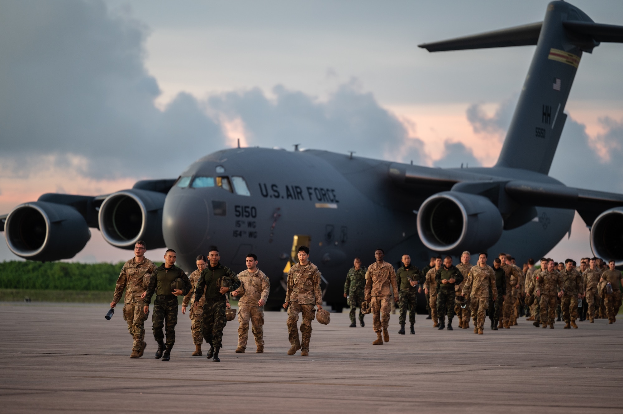 U.S. Army and Royal Thai Army soldiers walk on a flight line at Diego Garcia, British Indian Ocean Territory, Mar. 2, 2023, during Exercise Cobra Gold 2023. Cobra Gold, now in its 42nd year, is a Thai-U.S. co-sponsored training event that builds on the long-standing friendship between the two allied nations and brings together a robust multinational force to promote regional peace and security in support of a free and open Indo-Pacific. (U.S. Air Force photo by Staff Sgt. Alan Ricker)