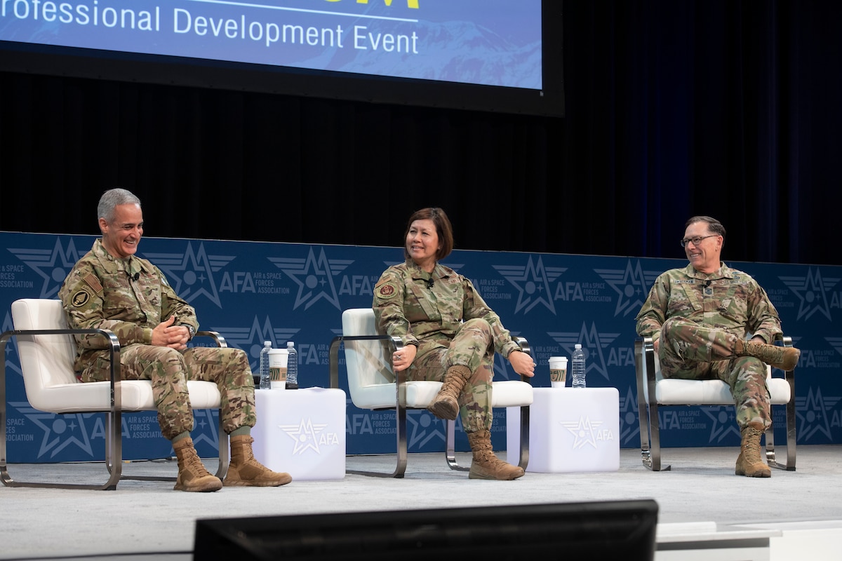 Senior Enlisted Advisor to the Chairman Ramón “CZ” Colón-López, left, Chief Master Sgt. of the Air Force JoAnne S. Bass, center, and Chief Master Sgt. of the Space Force Roger A. Towberman, right, discuss the state and future of enlisted forces in the Department of the Air Force during the Air and Space Forces Association Warfare Symposium Enlisted Imperative panel March 8. The panel highlighted the changing operational environment, ways Airmen and Guardians are critical to maintaining Air and Space dominance, and efforts to recruit and retain the best members. (U.S. Air Force photo by Tech. Sgt. William A. O'Brien)