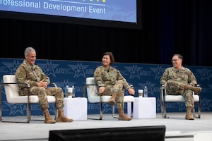 Senior Enlisted Advisor to the Chairman Ramón “CZ” Colón-López, left,  Chief Master Sgt. of the Air Force JoAnne S. Bass, middle, and Chief Master Sgt. of the Space Force Roger A. Towberman, right, pose for a photo following a discussion about the state and future of enlisted forces in the Department of the Air Force during the Air and Space Forces Association Warfare Symposium Enlisted Imperative panel March 8. The senior enlisted leaders expounded on the contributions of enlisted forces to Department of the Air Force efforts and enlisted roles in future conflicts. (U.S. Air Force photo by Tech. Sgt. William A. O'Brien)