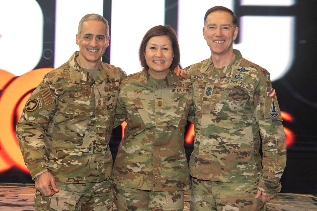 Senior Enlisted Advisor to the Chairman Ramón “CZ” Colón-López, left,  Chief Master Sgt. of the Air Force JoAnne S. Bass, middle, and Chief Master Sgt. of the Space Force Roger A. Towberman, right, pose for a photo following a discussion about the state and future of enlisted forces in the Department of the Air Force during the Air and Space Forces Association Warfare Symposium Enlisted Imperative panel March 8. The senior enlisted leaders expounded on the contributions of enlisted forces to Department of the Air Force efforts and enlisted roles in future conflicts. (U.S. Air Force photo by Tech. Sgt. William A. O'Brien)
