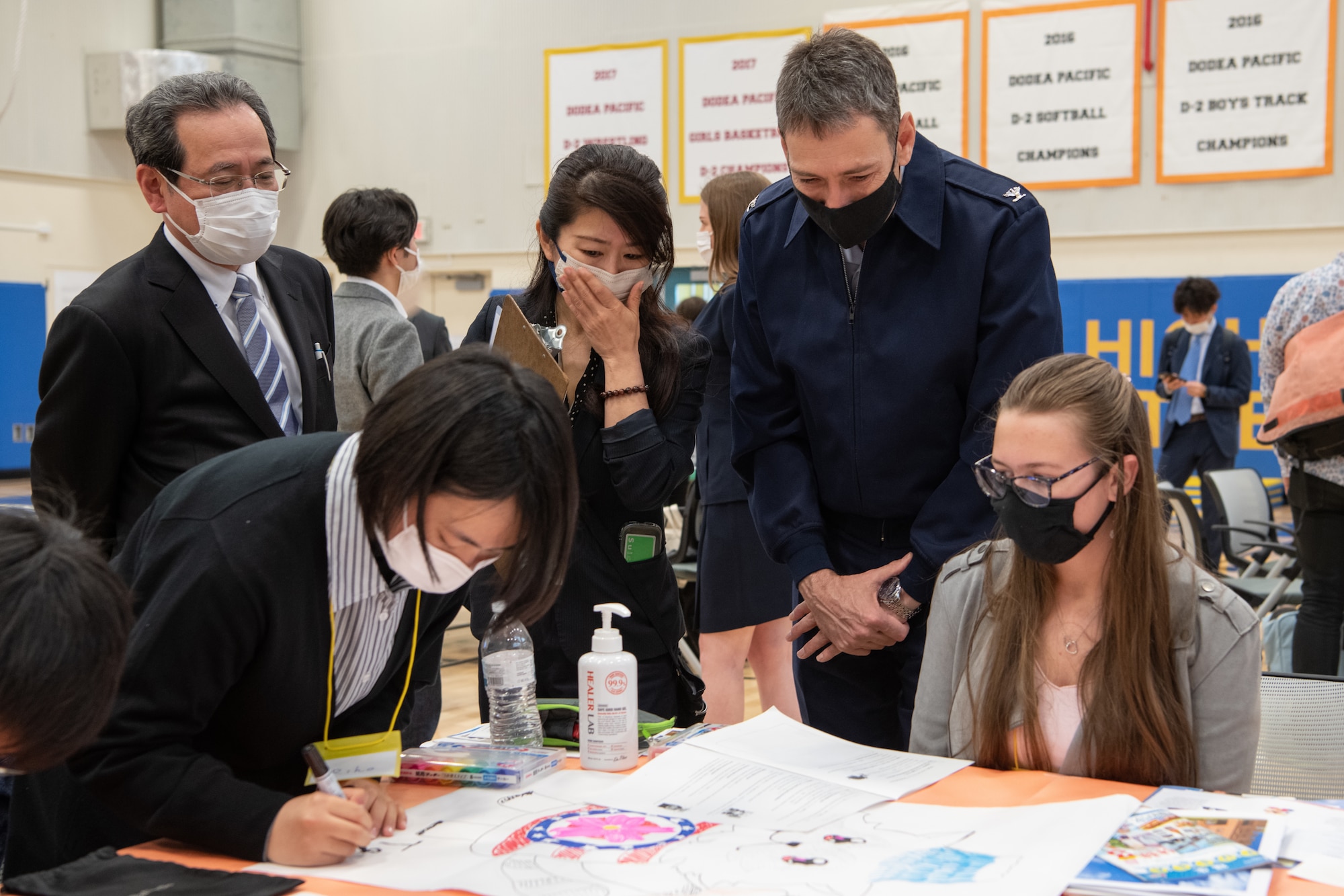 U.S. Air Force leadership and the Vice Mayor of Fussa City speak with students about their design projects