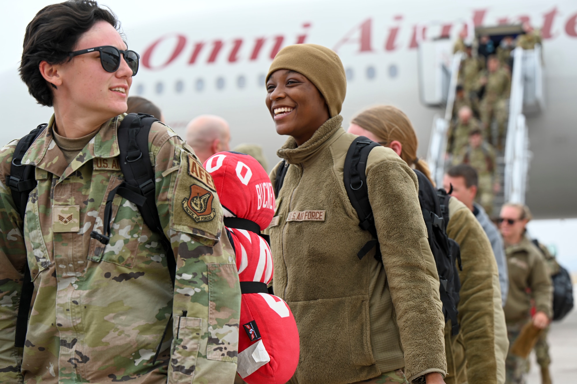 U.S. Air Force Airmen assigned to the 28th Bomb Wing disembark a Boeing 777-200ER at Ellsworth Air Force Base, South Dakota, Feb. 5, 2023, following a Bomber Task Force mission to the Indo-Pacific region. BTF missions are designed to showcase the Pacific Air Force’s ability to deter, deny, and dominate any influence or aggression from adversaries or competitors. (U.S. Air Force photo by Airman 1st Class Adam Olson)