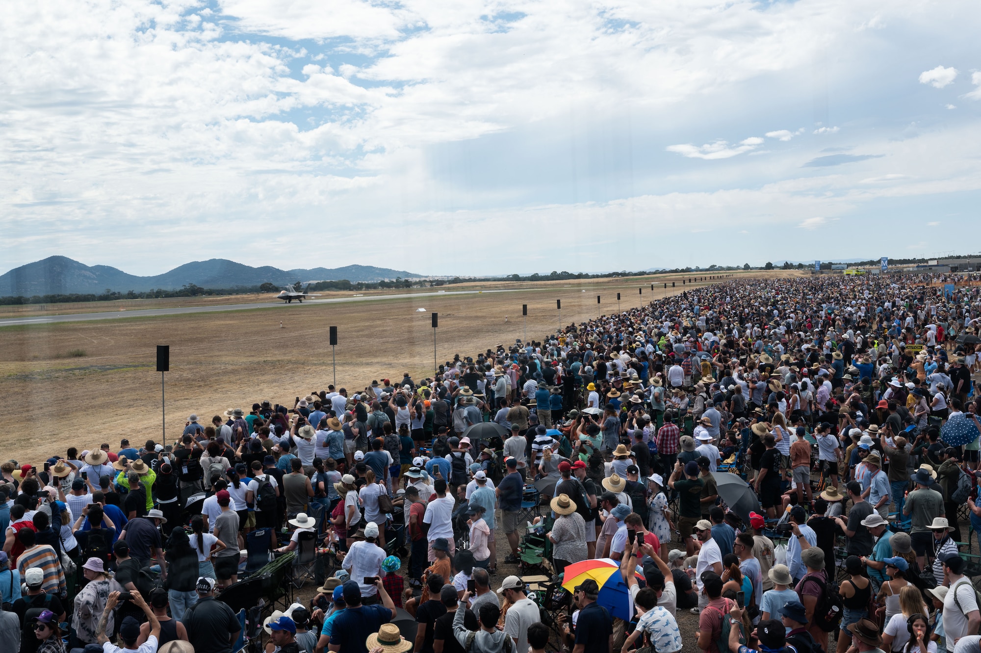 Spectators watch and take photos as an F-22 Raptor taxies for an aerial demonstration at the during the 2023 Australian International Airshow and Aerospace & Defence Exposition—AVALON 23—at Avalon International Airport, March 5, 2023. Our steadfast relationship with Australia, deeply rooted in our common principles and shared values, stems from working together day in and day out across the full spectrum of operations and will continue to prosper as we further integrate our efforts through events such as AVALON 23. (U.S. Air Force photo by Tech. Sgt. Hailey Haux)