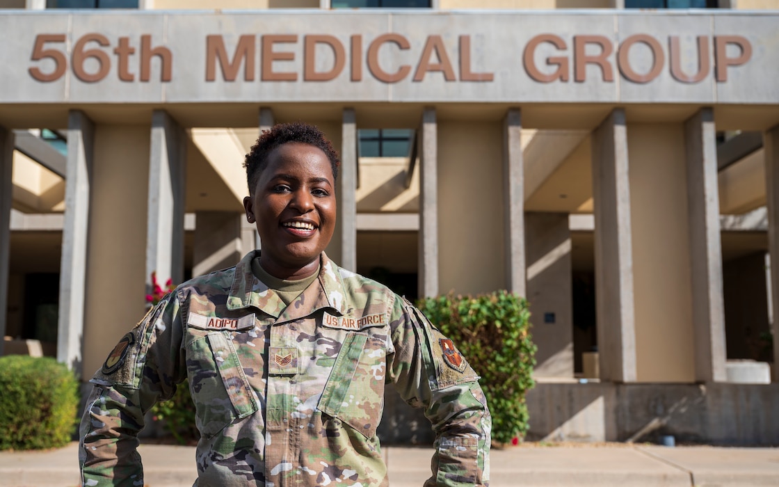 U.S. Air Force Staff Sgt. Winnie Adipo, 56th Medical Group noncommissioned officer in charge of personnel administration, poses for a photo in front of the 56th MDG building at Luke Air Force Base, Jan. 17, 2023.