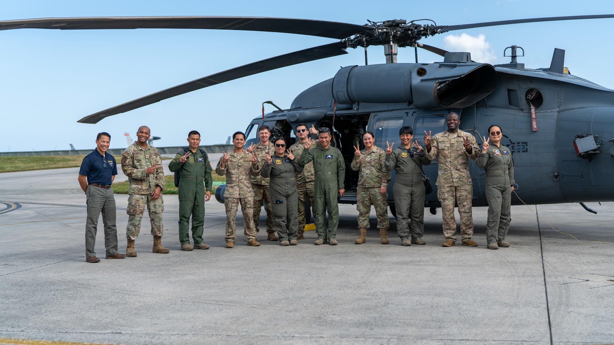 Philippine Air Force members and Airmen pose for a photo.