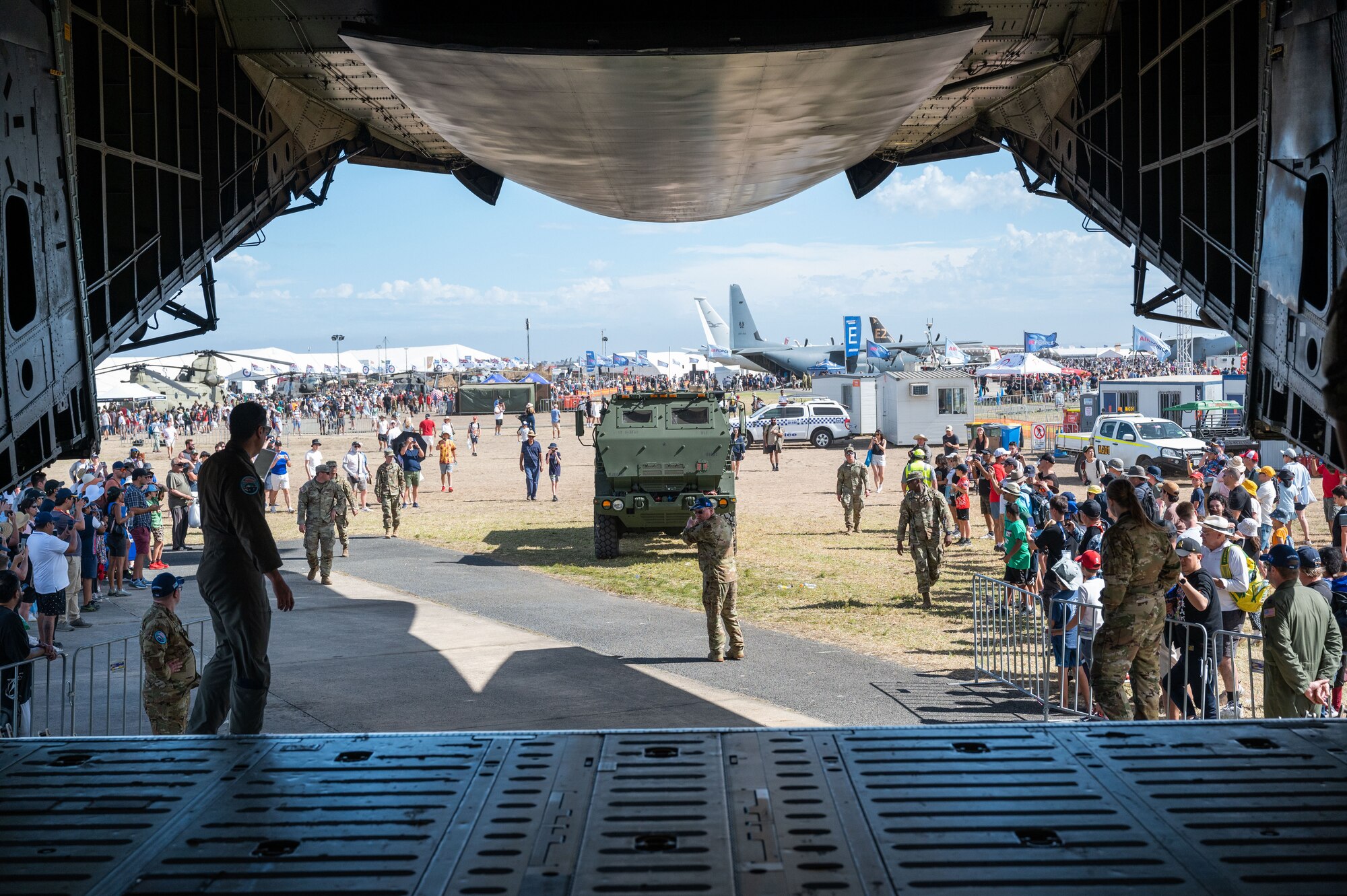 An M142 HIMARS gets loaded onto a C-5M Super Galaxy while spectators watch at the 2023 Australian International Airshow and Aerospace & Defence Exposition—AVALON 23—at Avalon International Airport, March 2, 2023. Our steadfast relationship with Australia, deeply rooted in our common principles and shared values, stems from working together day in and day out across the full spectrum of operations and will continue to prosper as we further integrate our efforts through events such as AVALON 23. (U.S. Air Force photo by Tech. Sgt. Hailey Haux)