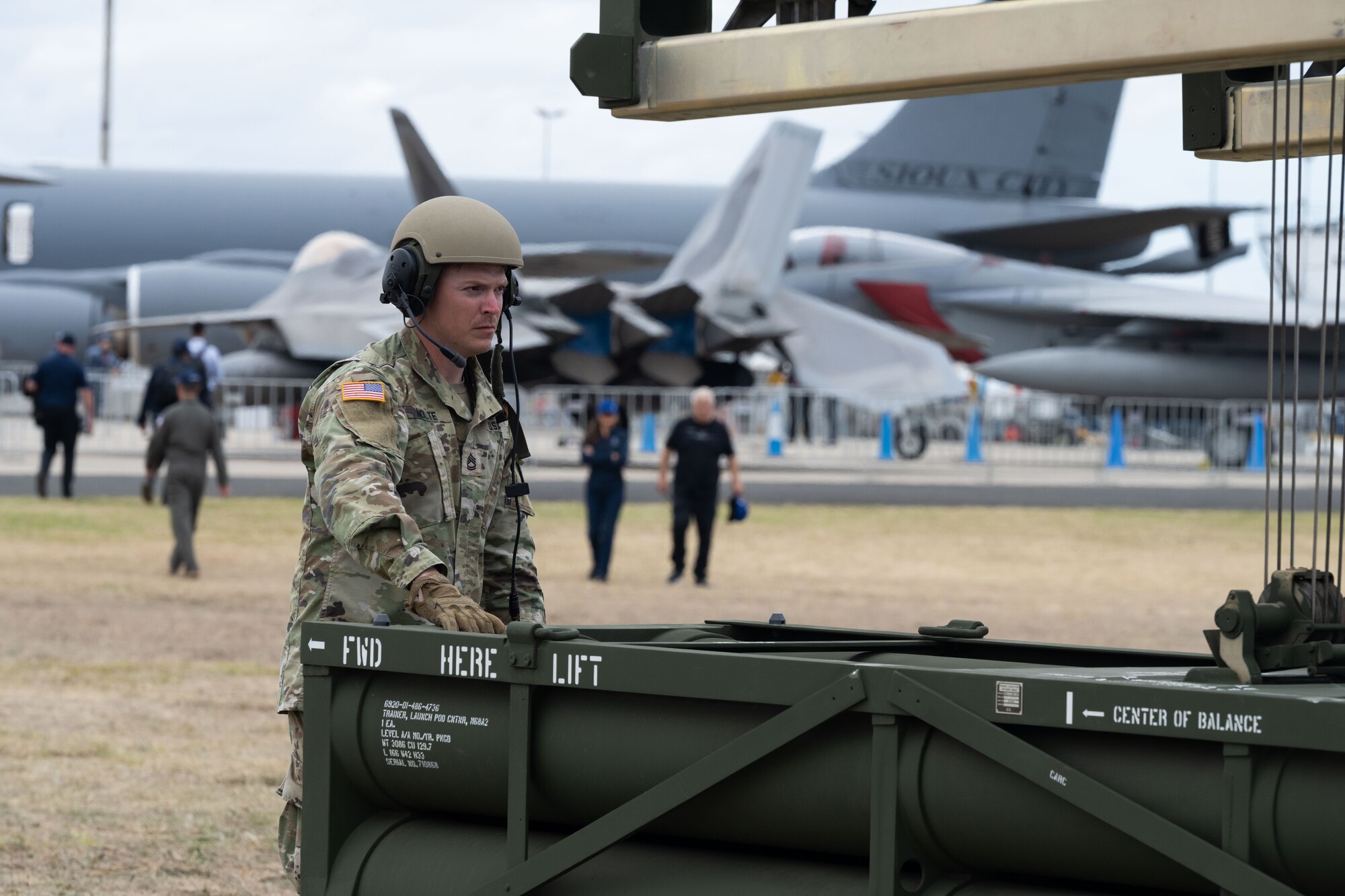 U.S. Army Sergeant First Class Taylor Nolte, Platoon Sergeant, Bravo Battery, 1-3 Field Artillery Regiment, 17th Field Artillery Brigade, demonstrates the capabilities of the High Mobility Artillery Rocket System—HIMARS-M142—to spectators at the 2023 Australian International Airshow and Aerospace & Defence Exposition—AVALON 23—at Avalon International Airport, March 1, 2023. The Department of Defense supported AVALON 23 with approximately 300 personnel and a number of various aircraft to include the F-22 Raptor, KC-46 Pegasus, C-17 Globemaster III, AH-64 Apache, M142 HIMARS among many others. The HIMARS is a full-spectrum, combat-proved, all-weather, 24/7, lethal and responsive, wheeled precision strike weapons system. (U.S. Air Force photo by Tech. Sgt. Hailey Haux)