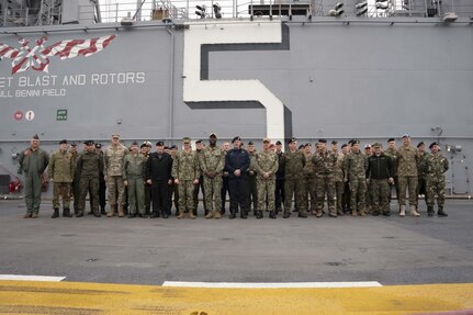 Group shot of NATO MC visit to USS Bataan.