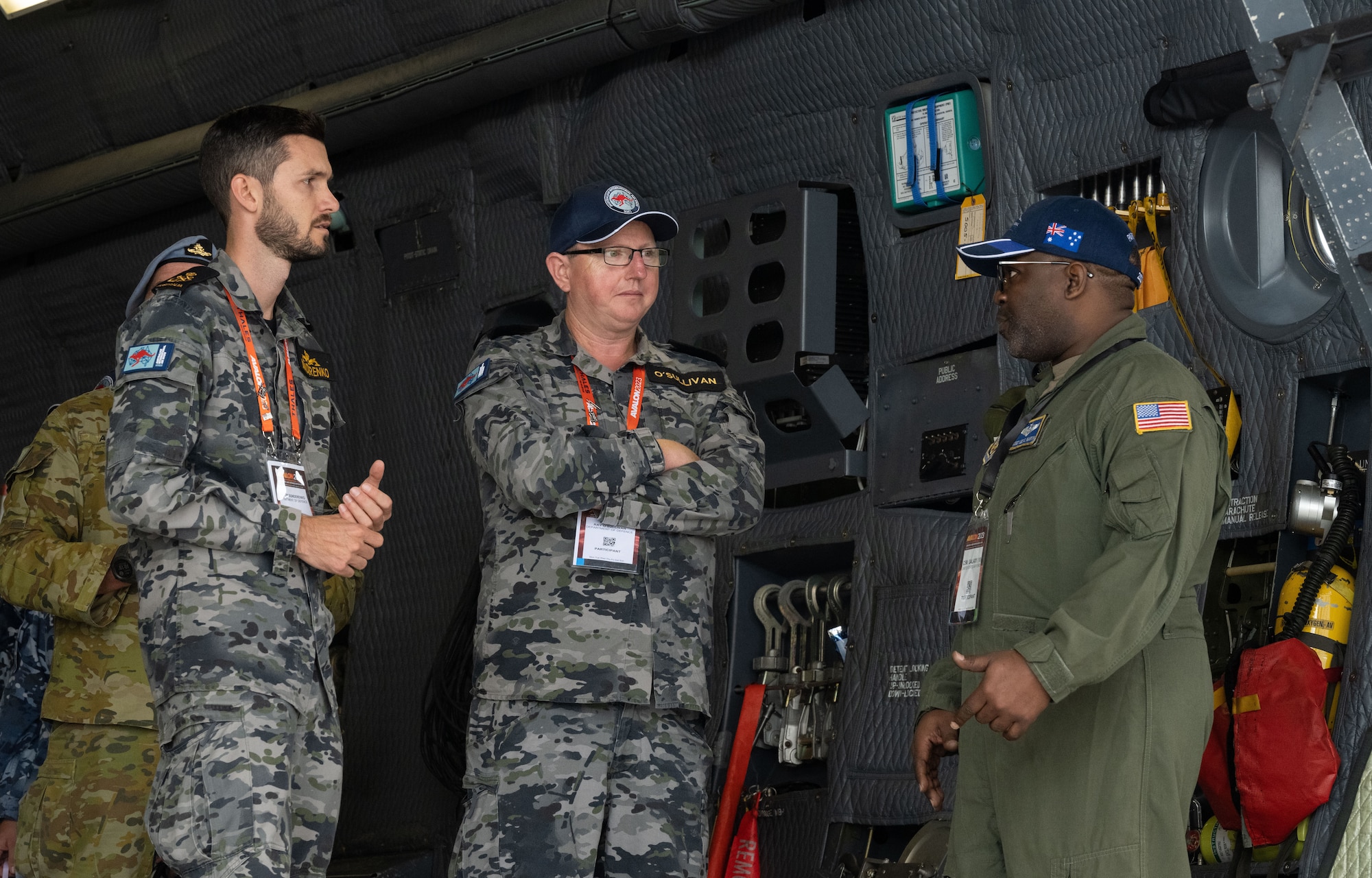 A U.S. Air Force C-5 Galaxy aircrew member discusses the capabilities of the aircraft with visitors during the 2023 Australian International Airshow and Aerospace & Defence Exposition—AVALON 23—at Avalon International Airport, March 2, 2023. AVALON 23 is the premier aerospace exhibition—airshow and tradeshow—in Australia and offers a venue to deepen our relationship with Australia and enhance regional security through expanded military-to-military cooperation with countries in the region. The C-5 Galaxy is a strategic transport aircraft and is the largest aircraft in the U.S. Air Force inventory. (U.S. Air Force photo by Tech. Sgt. Hailey Haux)