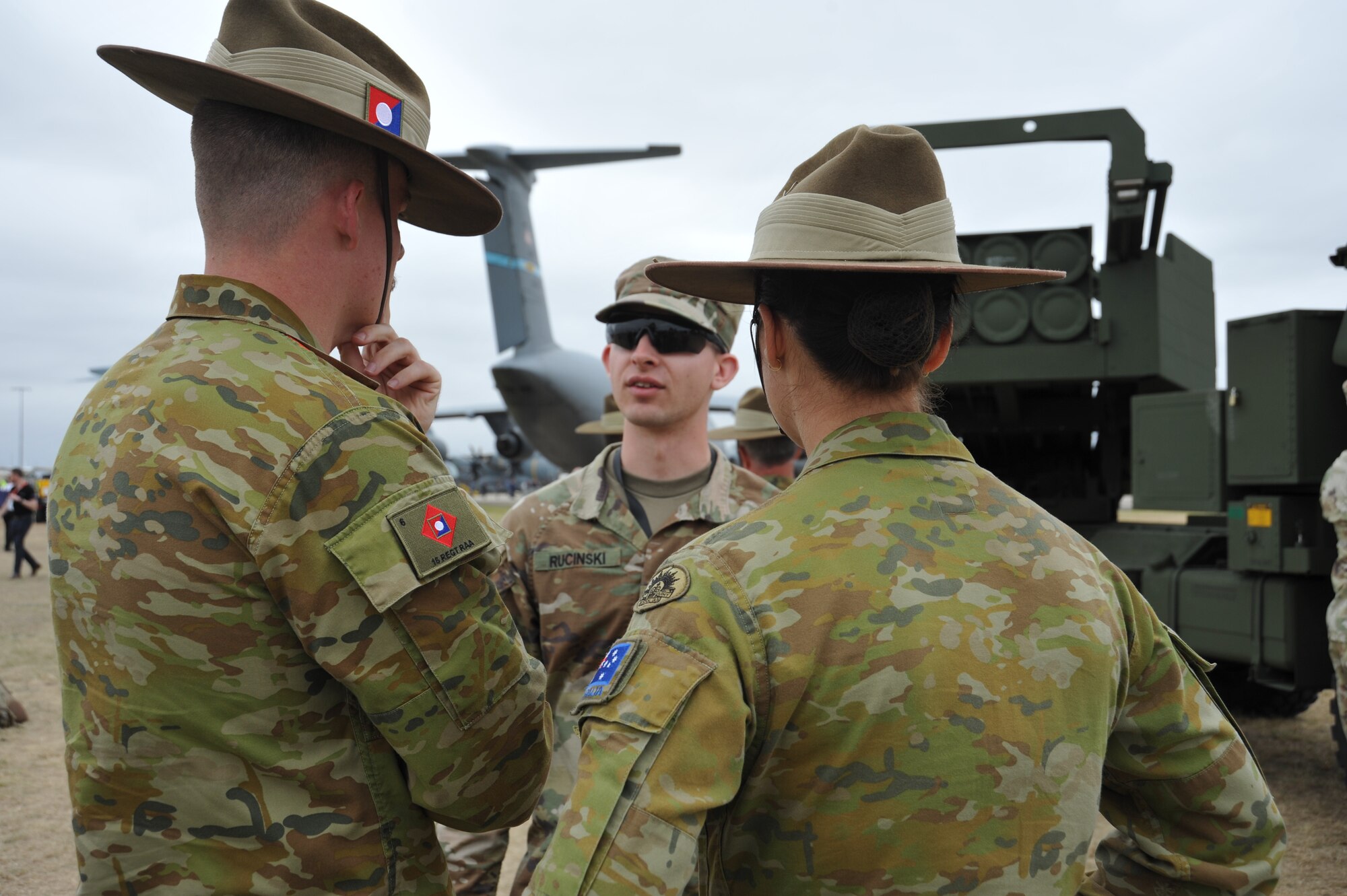 U.S. Army 2nd Lt. Brendan Rucinski, Bravo Battery, 1-3 Field Artillery Regiment, 17th Field Artillery Brigade Platoon Leader, speaks to the capabilities of the High Mobility Artillery Rocket System—HIMARS-M142—to spectators at the 2023 Australian International Airshow and Aerospace & Defence Exposition—AVALON 23—at Avalon International Airport, March 1, 2023. Our steadfast relationship with Australia, deeply rooted in our common principles and shared values, stems from working together day in and day out across the full spectrum of operations and will continue to prosper as we further integrate our efforts through events such as AVALON 23. The HIMARS is a full-spectrum, combat-proved, all-weather, 24/7, lethal and responsive, wheeled precision strike weapons system. (U.S. Air Force photo by 1st Lt. Alyssa Letts)