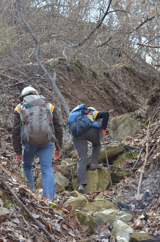 U.S. Army Corps of Engineers Formerly Utilized Sites Remedial Action Program contractors brave treacherous terrain near Central Stone Quarry at the confluence of Coldwater Creek and the Missouri River to collect soil samples during enduring efforts to find and remediate radioactive waste stemming from Manhattan Engineer District and early Atomic Energy Commission activities in north St. Louis County.