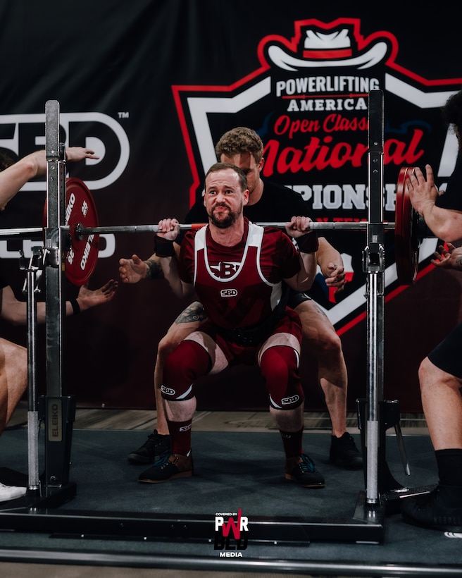 Special Agent Logan Dwyer, Detachment 303, Travis Air Force Base, Calif., shown squatting 286 pounds, finished second in the 163 pound men's weight class at the Powerlifting America 2023 Classic Open Nationals in Austin, Texas Feb. 24. (Photo courtesy PWRBLD Media)