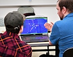 IMAGE: College students used the Joint Cognitive Operational Research Environment software to compete in the 2023 Artificial Intelligence and Machine Learning Innovation Challenge at Dahlgren. The software demonstrated three different scenarios involving a multitude of ships and threat counts to challenge the students’ decision-making.