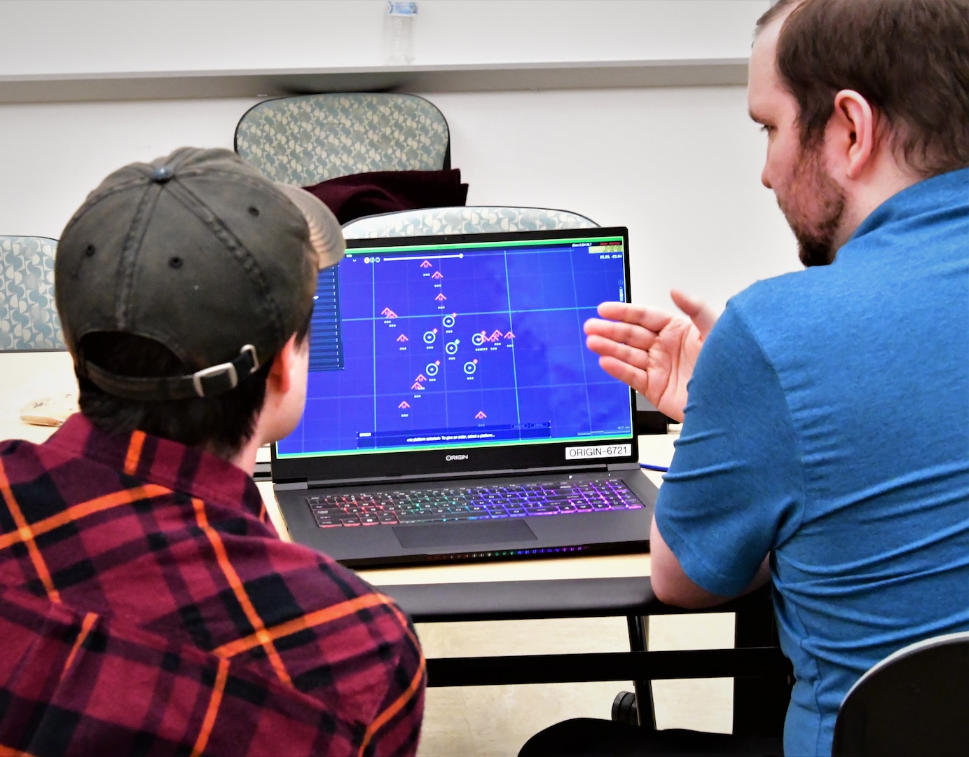 IMAGE: College students used the Joint Cognitive Operational Research Environment software to compete in the 2023 Artificial Intelligence and Machine Learning Innovation Challenge at Dahlgren. The software demonstrated three different scenarios involving a multitude of ships and threat counts to challenge the students’ decision-making.