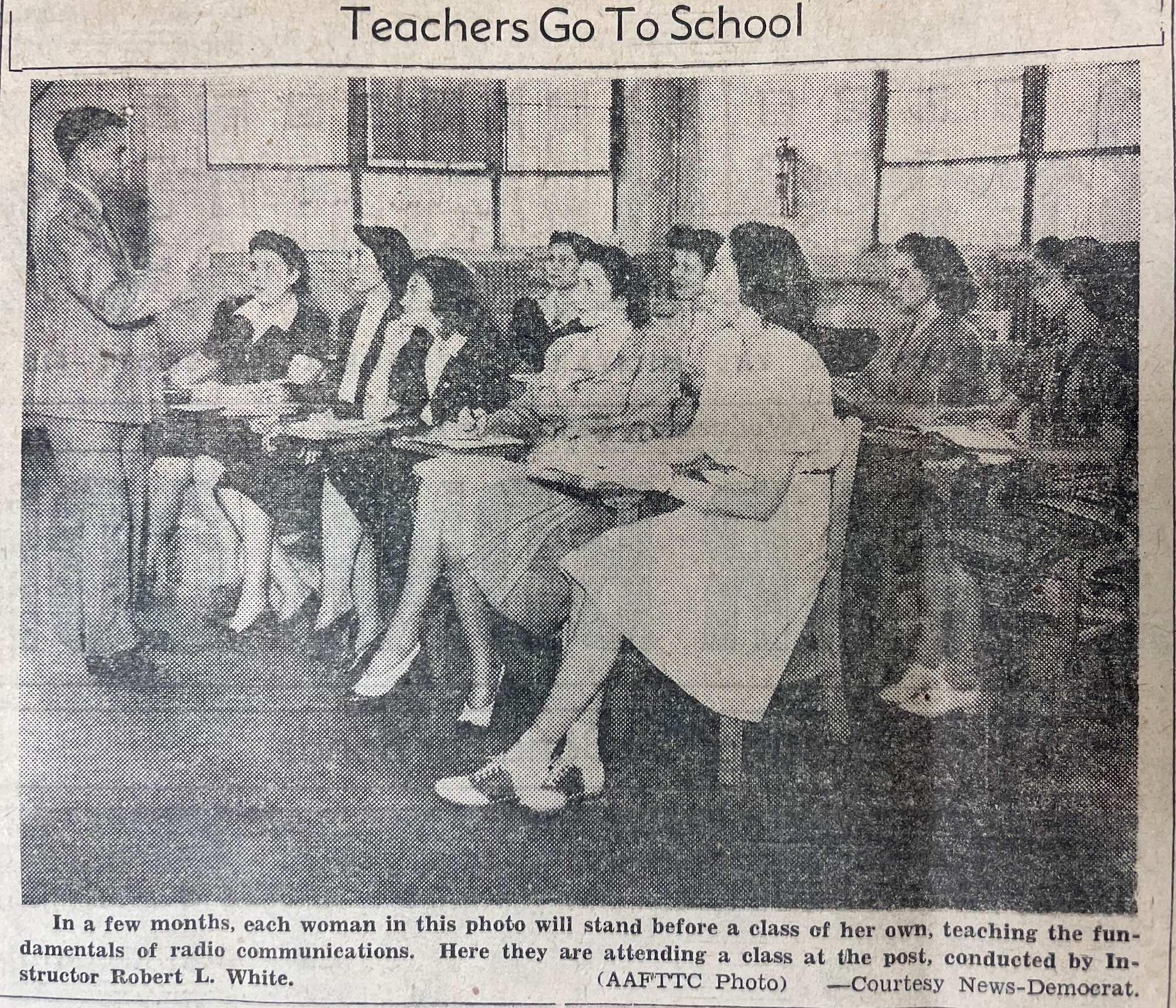 Women sit in class