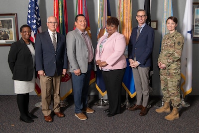 a group of six people stand together