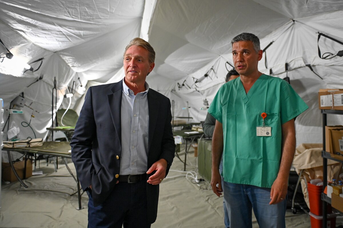 Dr. Onur Koyuncu, right, Mustafa Kemal University Hospital head physician, gives a tour of the field hospital on the grounds of Mustafa Kemal University to Jeffry Flake, U.S. Ambassador to Türkiye, in Serinyol, Hatay, Türkiye, March 7, 2023.