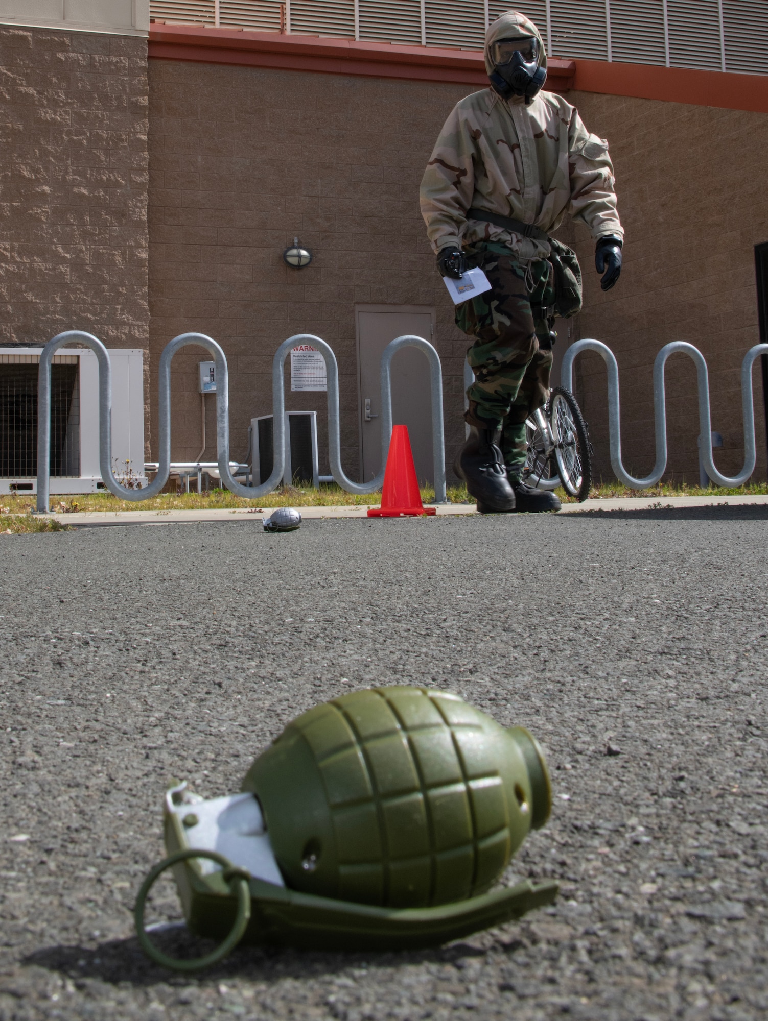 Airman standing by plastic grenade