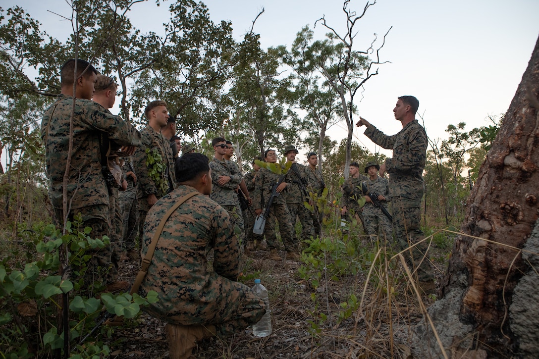 U.S. Marine Corps Gunnery Sgt. Joshua Owen, a motor transportation operations chief with Combat Logistics Battalion 7, Marine Rotational Force – Darwin, instructs Marines on different types of shelters during a wilderness survival training class at Mount Bundy Training Area, NT, Australia, June 5, 2021. Owen held a period of instruction on wilderness survival training for Marines with MRF-D participating in a field training exercise. The training focused on the importance of exposure reduction in any wild environment and various ways to set up a shelter. (U.S. Marine Corps photo by Sgt. Micha Pierce)