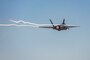 Photo of an F-35 fighter jet in the air. 