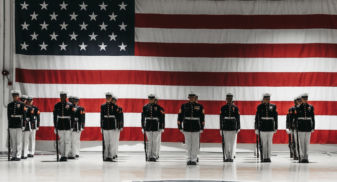 The Silent Drill Platoon performs for the Marines, future Marines, and their families during a Family Day performance at the Alaska National Guard Armory in Anchorage, Alaska, on March 3, 2023. The visit is part of a joint effort between Marine Barracks Washington and Marine Corps Recruiting Command designed to increase awareness of the Marine Corps and prepare the unit for the upcoming summer parade season at Marine Barracks Washington, D.C., the oldest post in the Marine Corps.