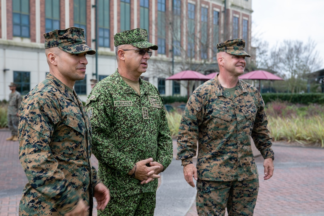 Lt. Gen. David G. Bellon, commander of U.S. Marine Corps Forces, South, and Marine Forces Reserve, right, and Master Sgt. Sergio Macias, theater security cooperation branch chief, left, welcome Brig. Gen. Jorge Federico Torres Mora, commandant of the Colombian Marine Corps, at Marine Corps Support Facility New Orleans, Feb. 28, 2023. Torres, and the Colombian delegation, traveled to various locations within the United States to conduct key leadership engagements aimed at advancing institutional knowledge and processes. These engagements are critical elements to maintaining interoperability and to continue to strengthen the partnership between the two marine corps.