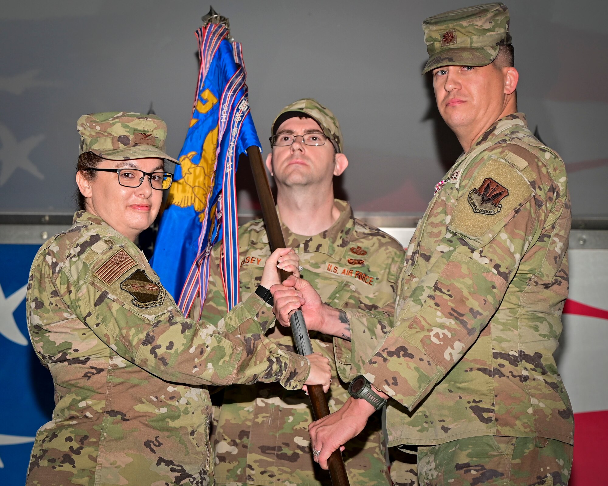 Col. Kathryn Roman, left, 4th Maintenance Group commander, receives the guidon from Maj. Mark Smith, 4th Component Maintenance Squadron outgoing commander, during a change of command ceremony at Seymour Johnson Air Force Base, North Carolina, March 3, 2023. This event serves to formally and publicly transfer command of the 4th CMS from the outgoing to the incoming commander. (U.S. Air Force photo by Staff Sgt. Sean Martin)