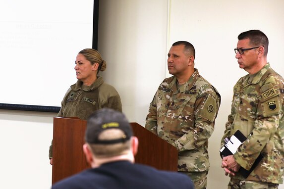 Lt. Col. Kristin Martins, Battalion Commander, 3-356 Logistical Support Battalion, Joint Base Lewis-McChord, Washington, left, Command Sgt. Maj. Eduardo Amesquita, center, and Lt. Col. Brian Cracchiola conduct their briefing during a Battalion Command Teams Training event at the 85th U.S. Army Reserve Support Command’s headquarters, during their battle assembly weekend, March 3-5, 2023.